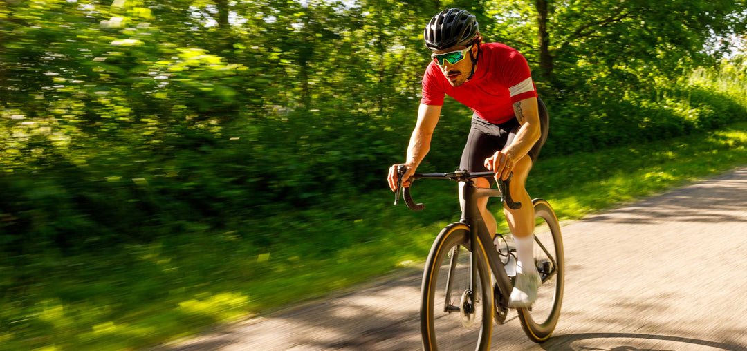 Man riding bike through scenic path