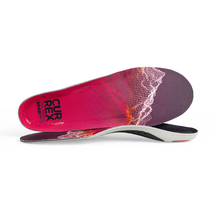 View of pair of red low profile EDGEPRO insoles, one standing on side to show top of insole, second insole set in front showing its profile while toe is facing opposite direction #profile_low