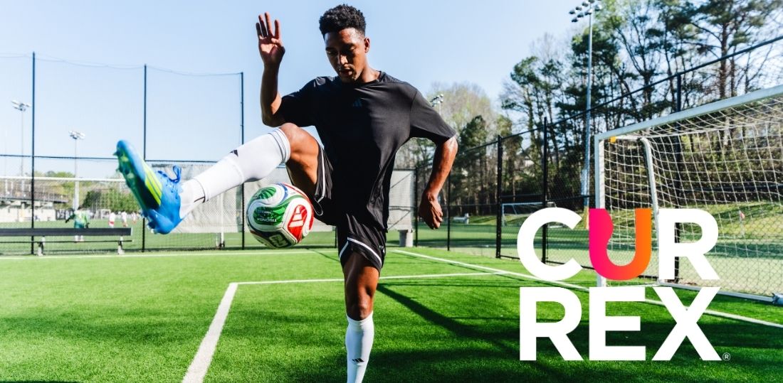 Alex Freeman doing a trick with the soccer ball on a soccer field