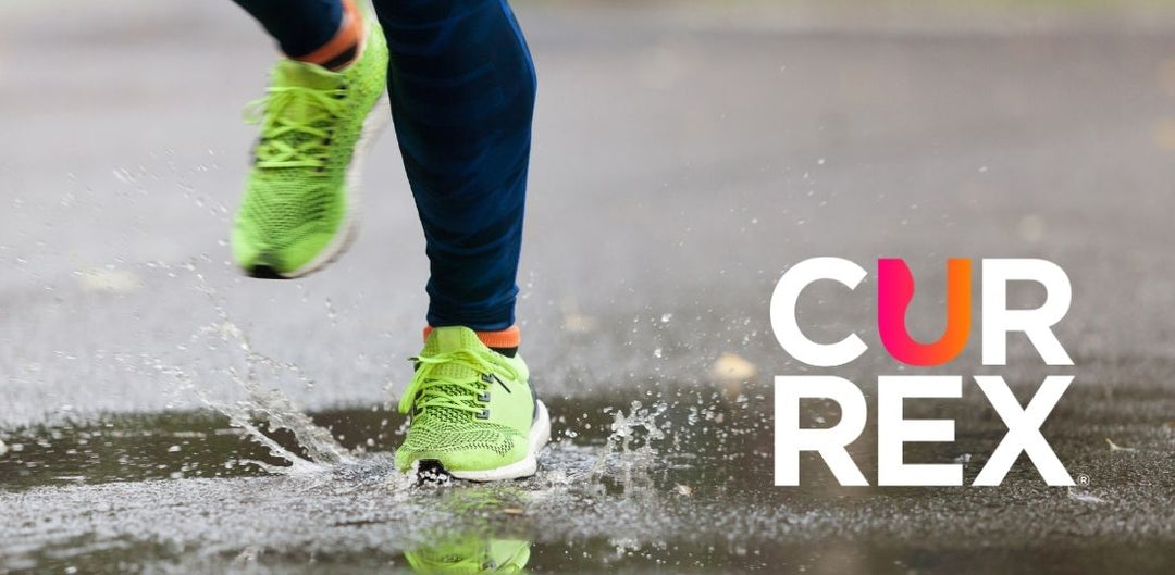 Shot of shoes running through a puddle