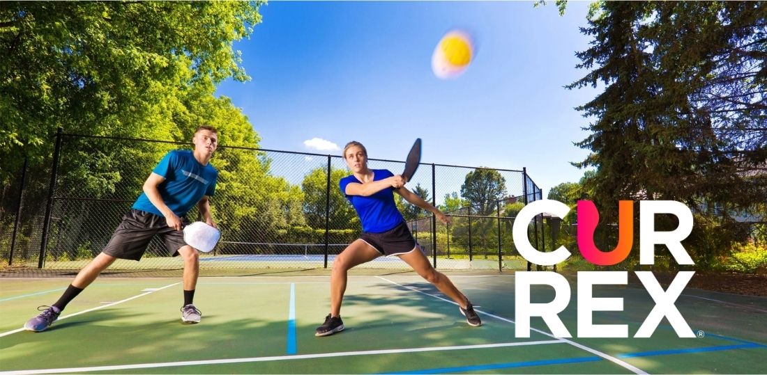 A couple playing pickleball