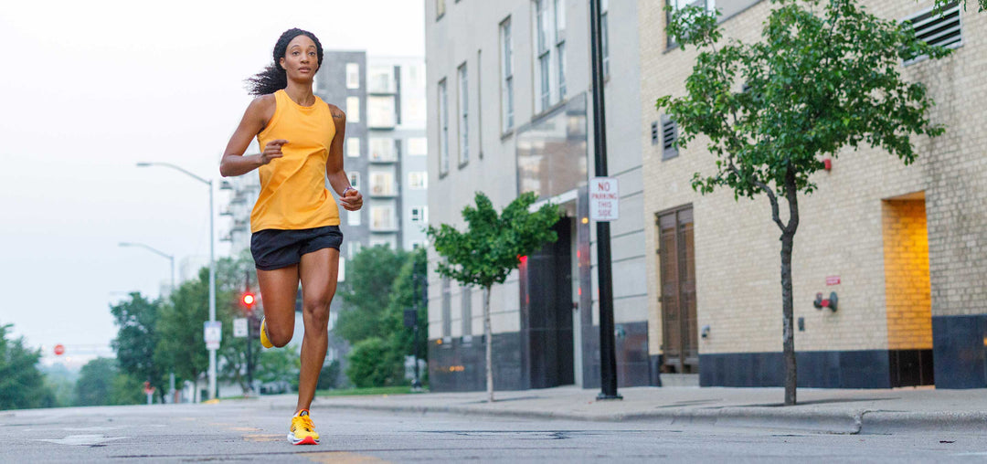 Woman jogging down street