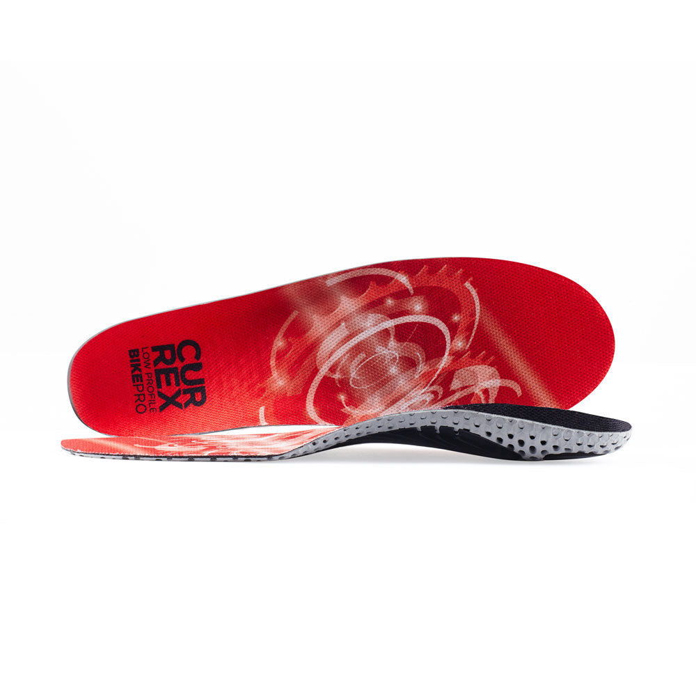 View of pair of red low profile BIKEPRO insoles, one standing on side to show top of insole, second insole set in front showing its profile while toe is facing opposite direction #profile_low