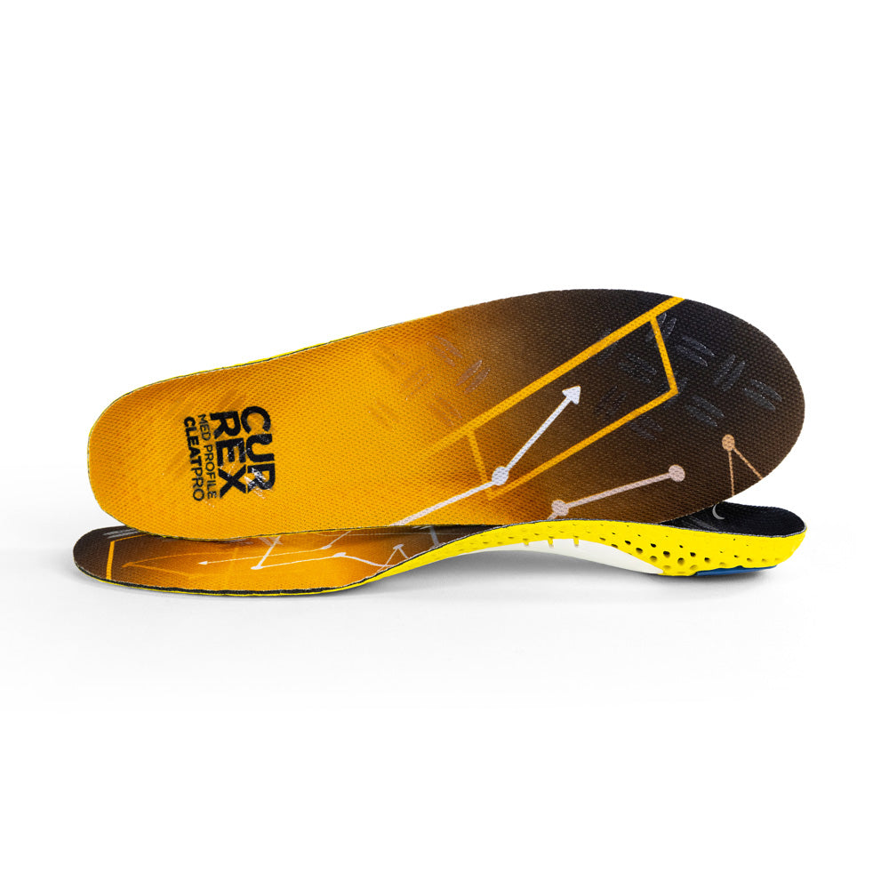 View of pair of yellow medium profile CLEATPRO insoles, one standing on side to show top of insole, second insole set in front showing its profile while toe is facing opposite direction #profile_medium