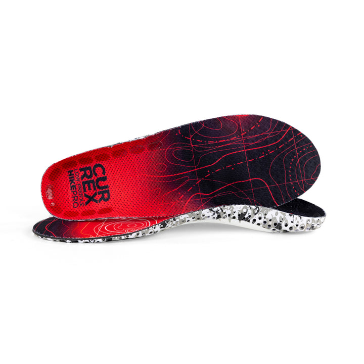 View of pair of red low profile HIKEPRO insoles, one standing on side to show top of insole, second insole set in front showing its profile while toe is facing opposite direction #profile_low