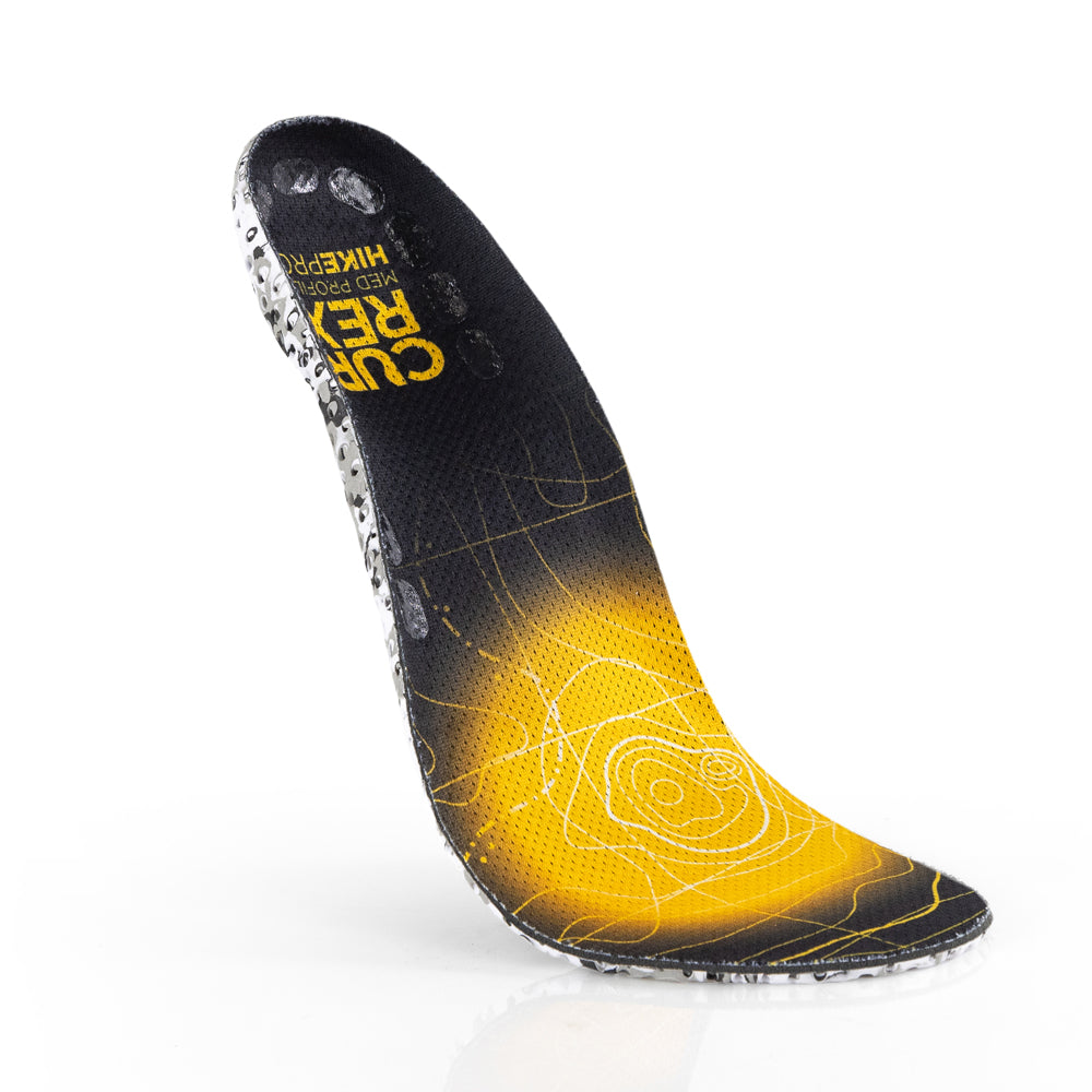 Floating top view of yellow colored HIKEPRO medium profile insoles with white and black camo base #profile_medium