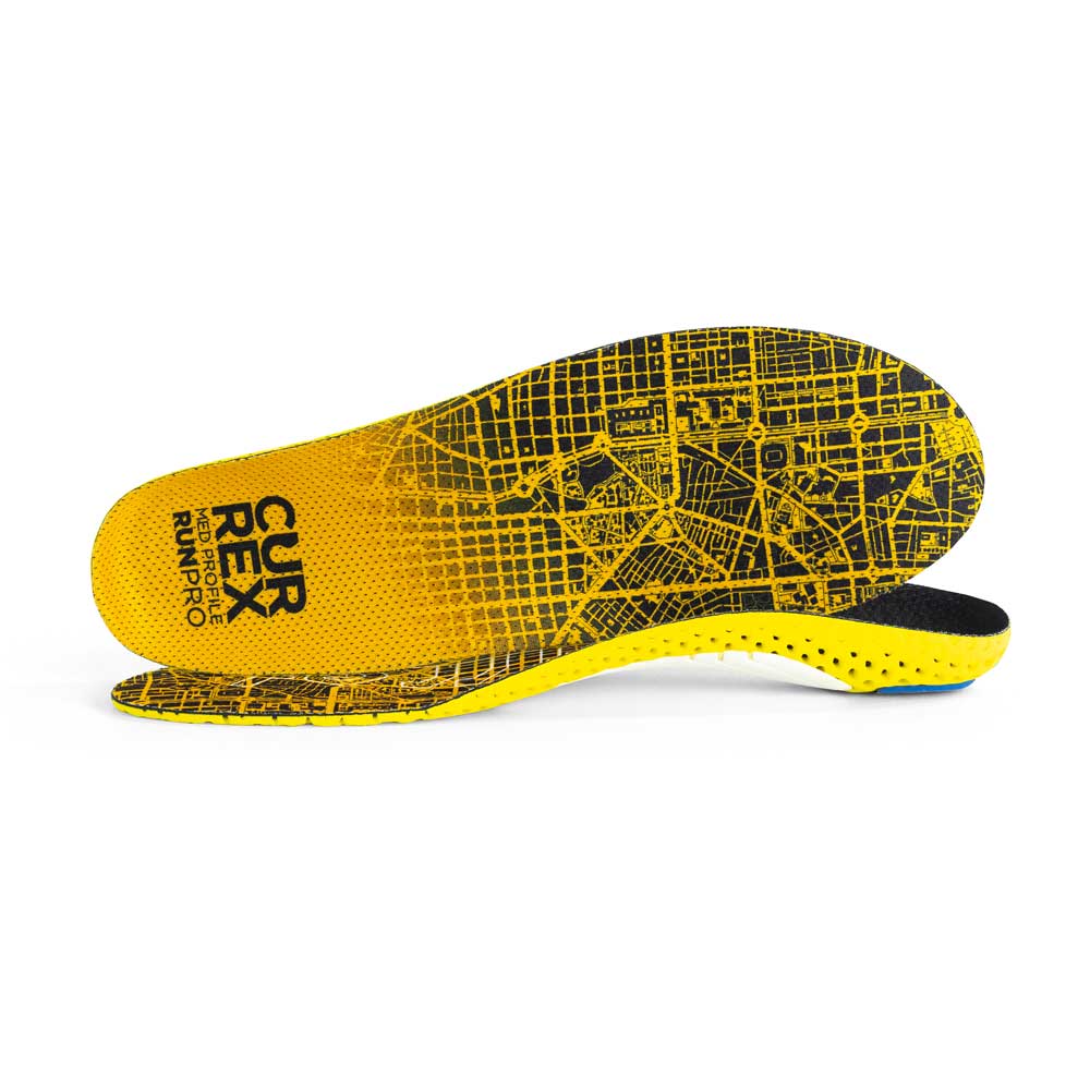 View of pair of yellow orange medium profile RUNPRO insoles, one standing on side to show top of insole, second insole set in front showing its profile while toe is facing opposite direction #profile_medium