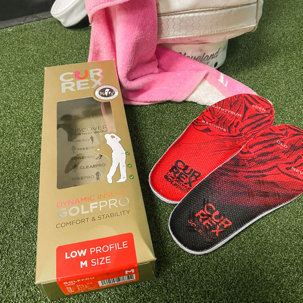 CURREX GOLFPRO low profile red insoles sitting next to golfbag #profile_low