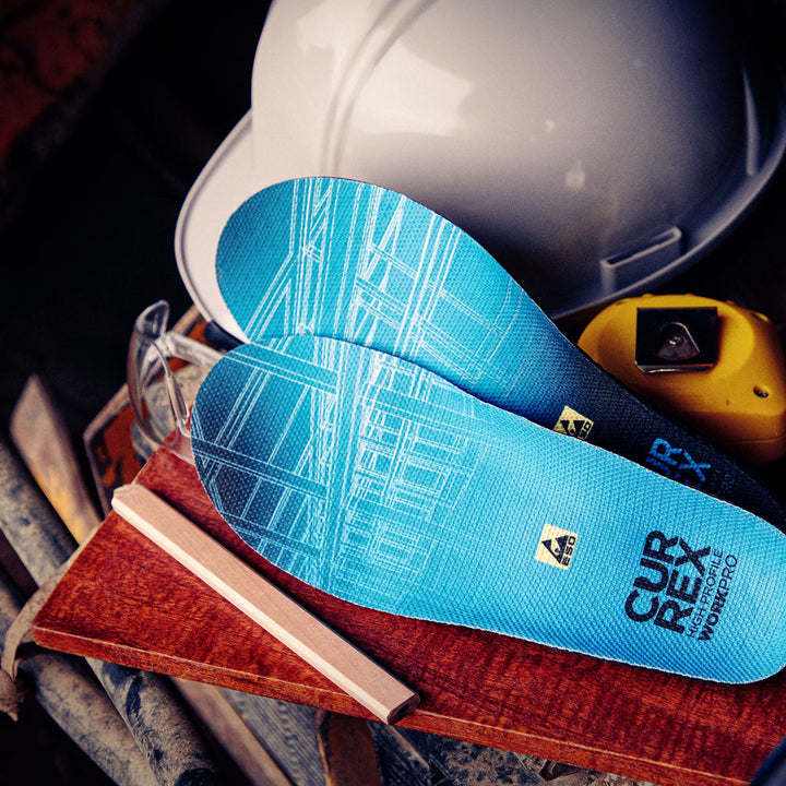 CURREX WORK blue high profile insoles next to safety helmet and measuring tape #profile_high